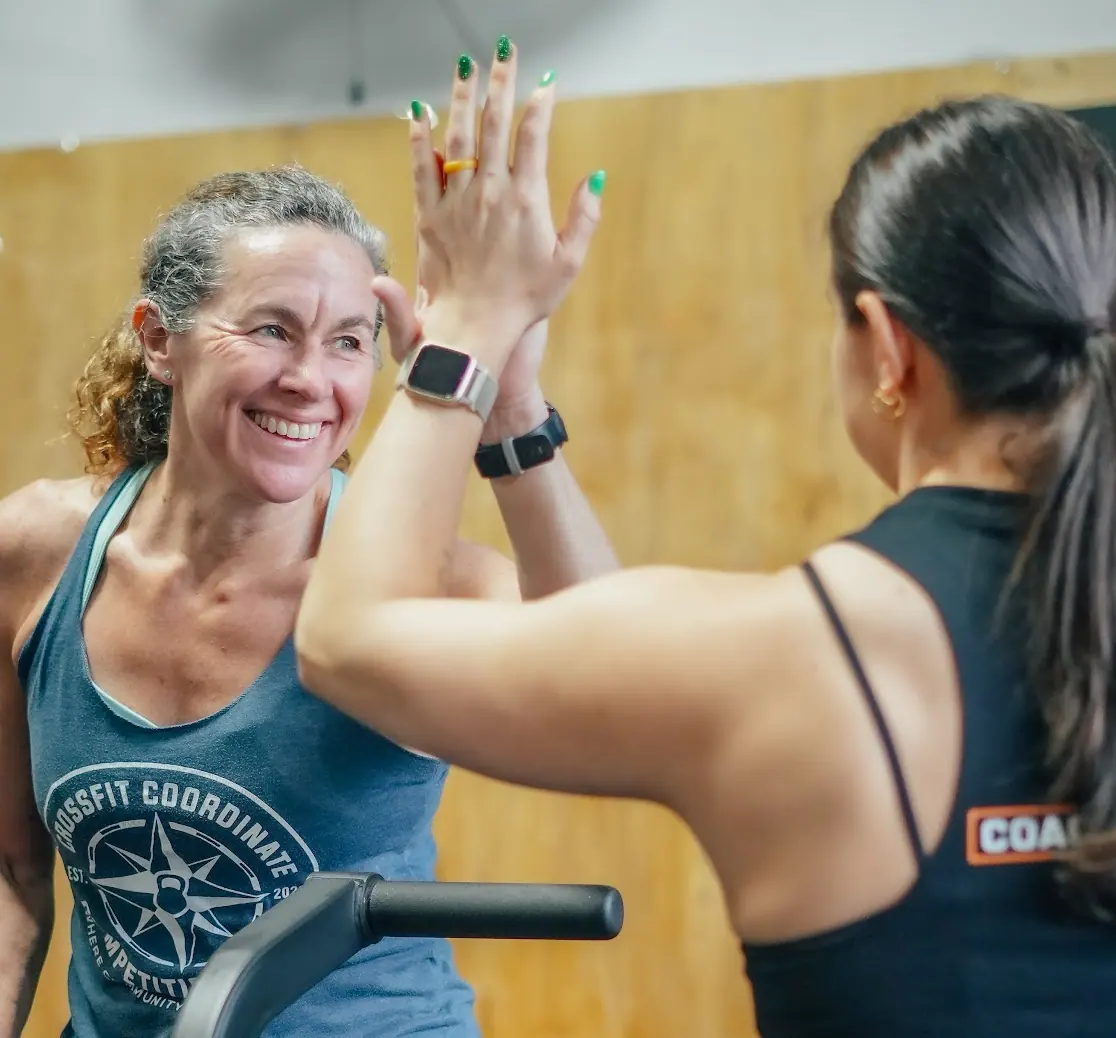 CrossFit Coordinate members smiling after a hard workout in Cary, NC