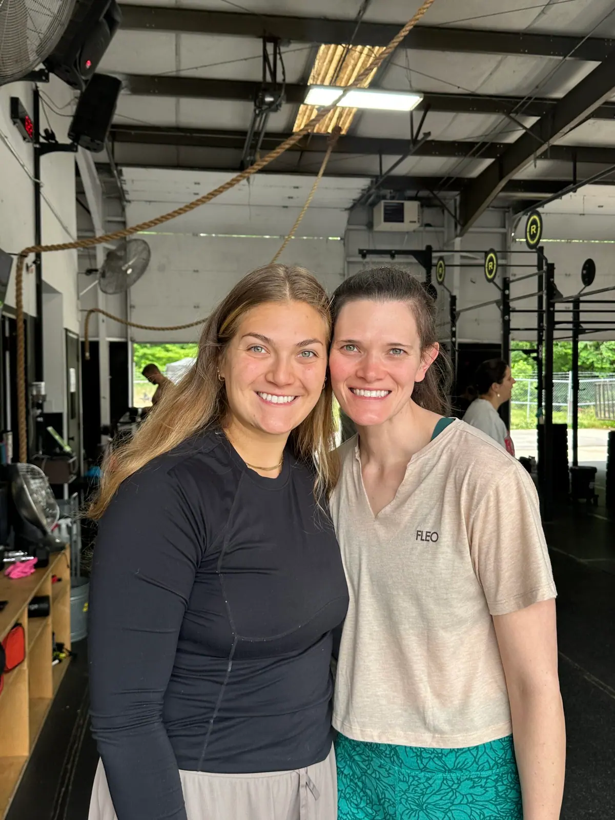 Camila celebrating her 50-class postpartum CrossFit milestone at CrossFit Coordinate in Cary, NC