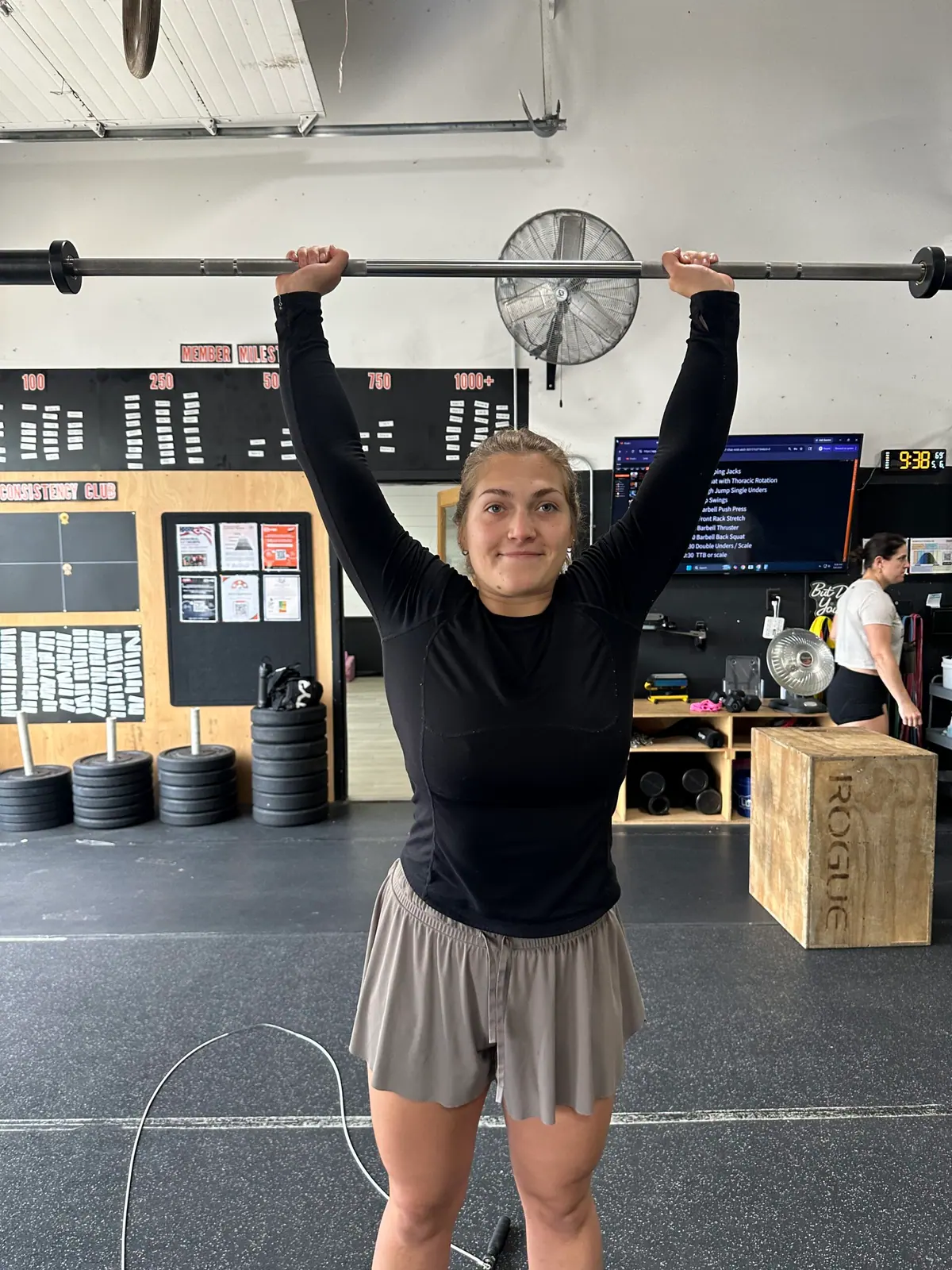 Postpartum CrossFit training — Camila lifting a barbell during a class at CrossFit Coordinate Cary, NC
