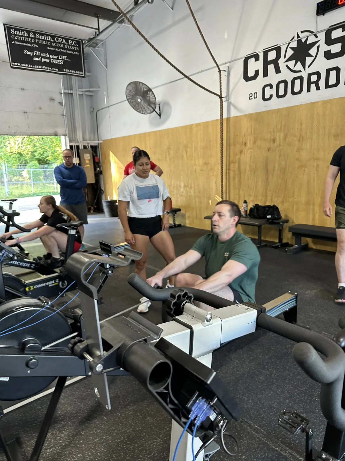 Teammate cranking out meters on the Concept2 BikeErg during the Ergathlon
