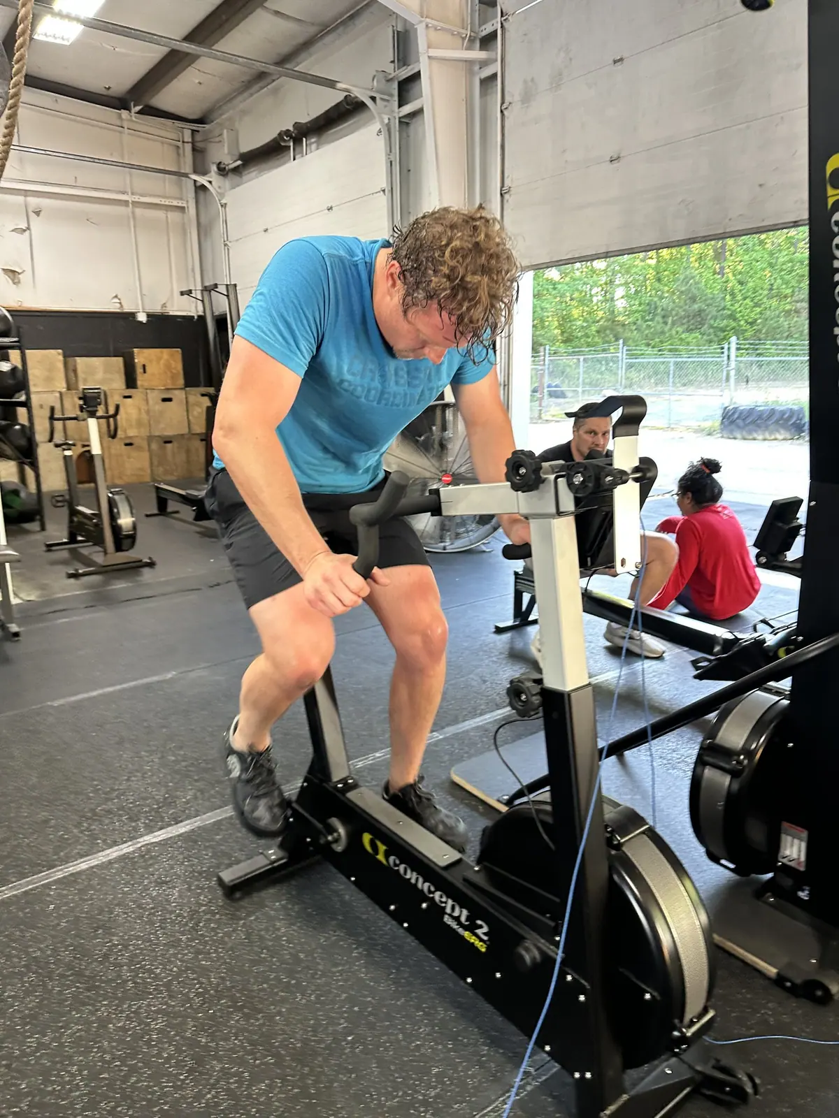 Full-send rowing stroke on the Concept2 rower during the 5,000m row leg