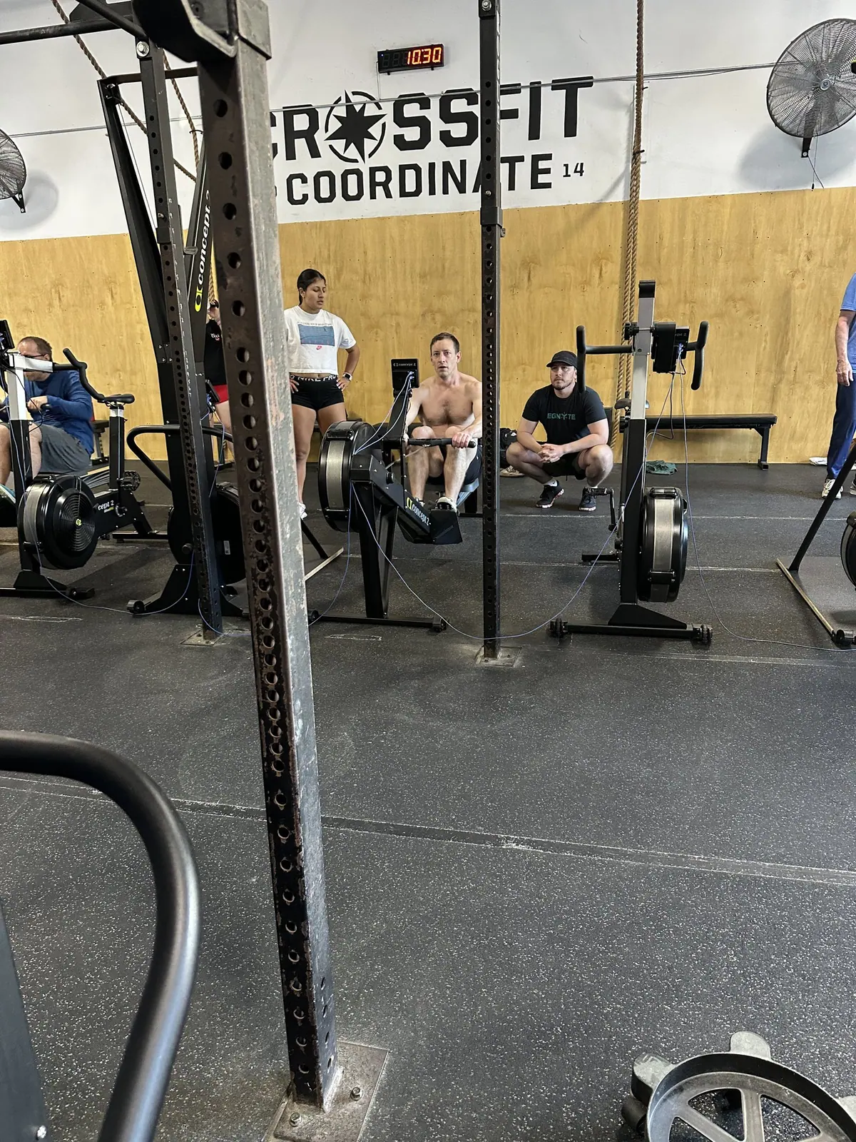 Wide view of the CrossFit Coordinate main floor packed with Ergathlon competitors mid-event