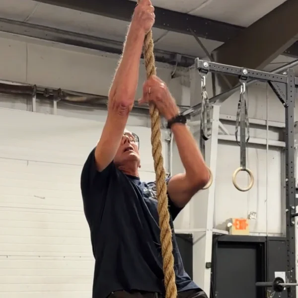 Heinz climbing a rope at CrossFit Coordinate in Cary, NC.