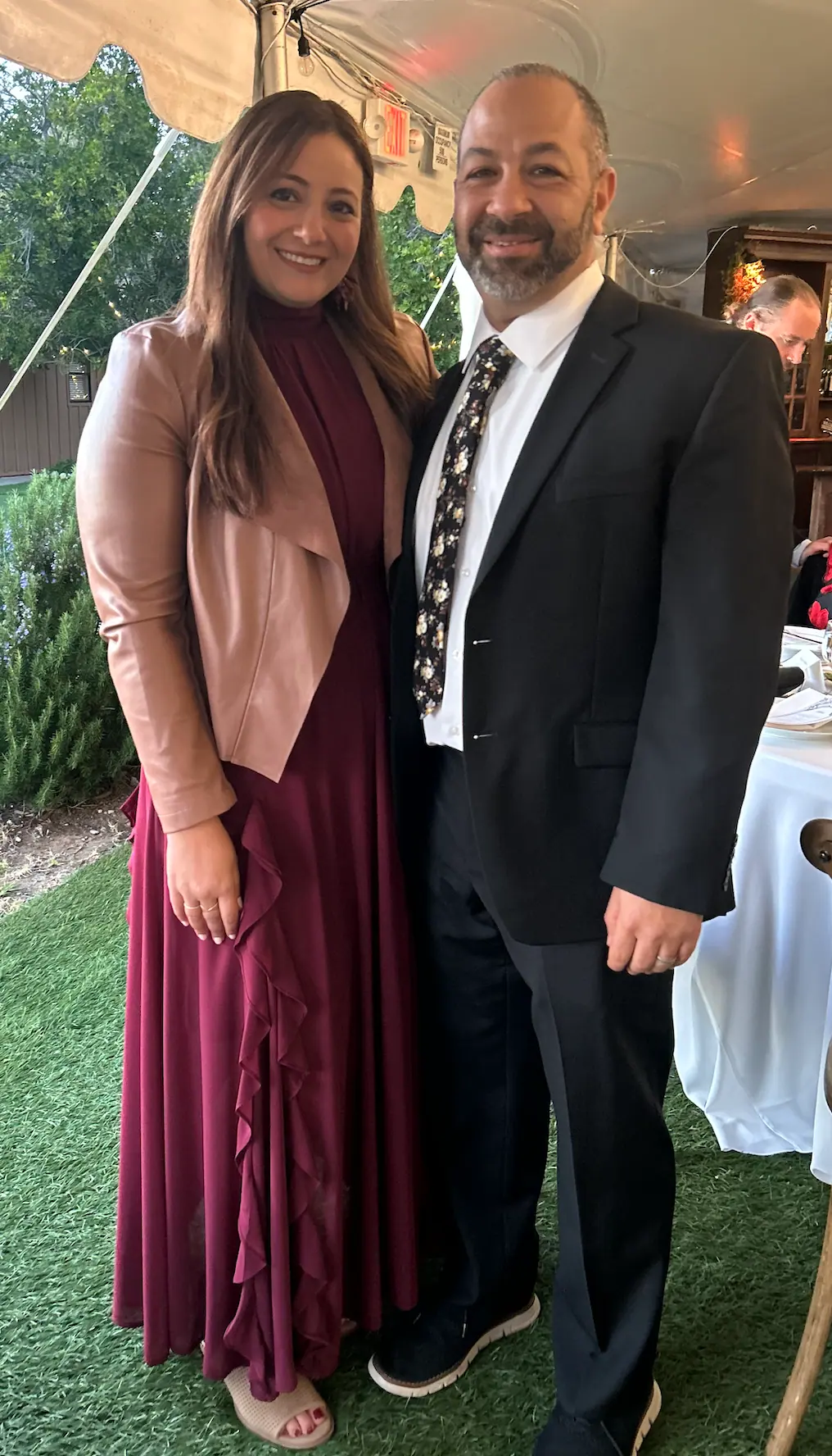 Sarah and her husband at a wedding celebration, looking confident and healthy after her 30-pound weight loss transformation through CrossFit Coordinate nutrition coaching