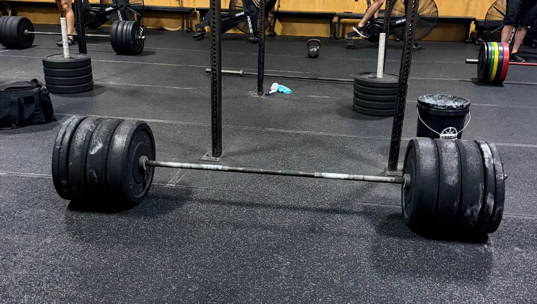 A loaded barbell set up for one of CrossFit's Girl WODs benchmark workouts at CrossFit Coordinate in Cary, NC